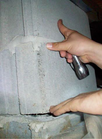 a completely failing concrete crawl space support pillar in Newberry