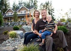 A happy family outside a home with a repaired foundation in Chester