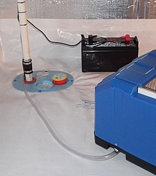 Closeup of a crawl space sump pump installed in Hendersonville