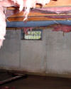 North Carolina, South Carolina & Georgia crawl space with vents, showing mold, rot, and fiberglass insulation dripping off the ceiling.