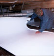 Greer insulation being installed in a crawl space.