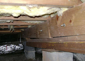 sagging crawl space with wooden shimming a Seneca crawl space
