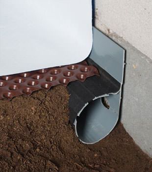 Closeup of a crawl space drainage system installed in Pickens