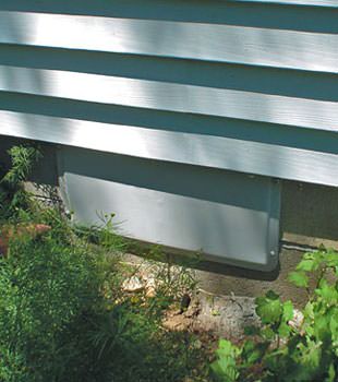 A gray crawl space vent cover in Irmo