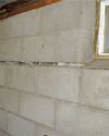 Severely buckling foundation walls in a home in Brevard in need of repairs.