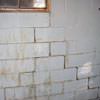 A cracked foundation wall near a window in a Chester home