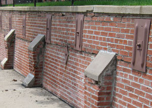 Rusted wall plate anchors in a retaining wall repair in Belton.