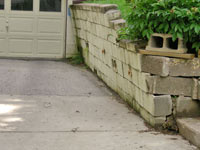 a failing retaining wall around a driveway in Asheville