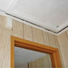 The ceiling and wall separating as the wall sinks with the slab floor in a Inman home