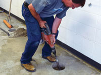 Coring the concrete of a concrete slab floor in Taylors