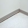 A partition wall separating from the floor in a Candler home.