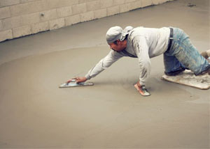 smoothing out the grout in a slab releveling project in Greer