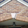 Major tuckpointing on a home archway over a door, with tuckpointing several inches wide that has failed on a Asheville home