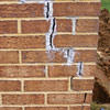 Tuckpointing that cracked due to foundation settlement of a Greenville home