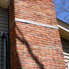 A tilting chimney on a Franklin home with a leaning, tilting chimney that was temporarily repaired.