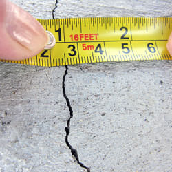 A crack in a poured concrete wall that's showing a normal crack during curing in Clemson