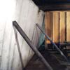 Temporary foundation wall supports stabilizing a Anderson home