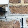Failed crack repair showing old tuckpointing that cracked on a Spartanburg home.