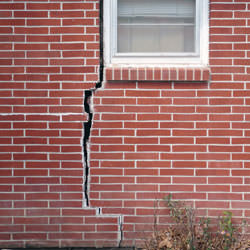 A foundation with a large crack that's wider at the top than on the bottom in Pickens