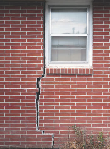 severe foundation wall cracks along a window in Piedmont