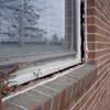 A gap in a window along the outer wall due to foundation settlement of a Seneca home.