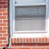 A gap in a window along the outer wall due to foundation settlement of a Seneca home.