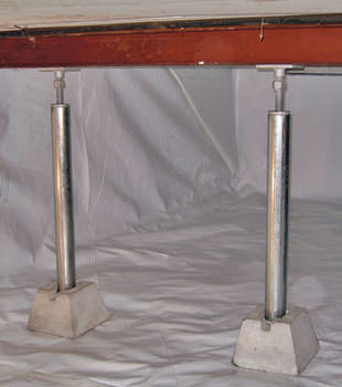 Crawl space jack posts installed in conjunction with a crawl space vapor barrier in Pickens
