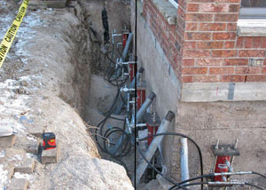 Foundation push piers installed around a house with a foundation settlement issues in Pickens
