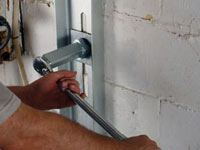 Mounting a foundation wall channel anchor in Greer.