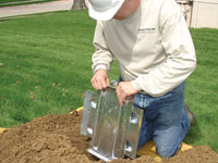Fastening an earth anchor for a severely bowing wall in Hendersonville.