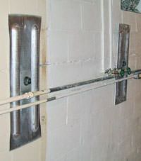 A foundation wall anchor system used to repair a basement wall in Toccoa