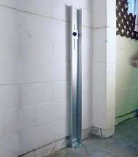 A failing foundation wall repaired with a foundation wall channel anchor system in a Anderson home.