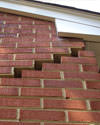 Serious damage to a foundation wall due to settlement of a home in Candler