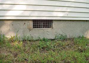 Open crawl space vents that let rodents, termites, and other pests in a home in West Columbia