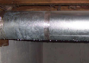 condensation collecting on an HVAC vent in a humid Taylors basement