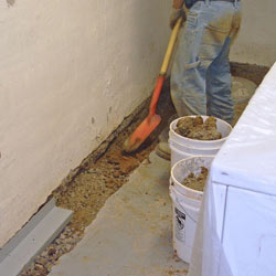 Digging a trench for a French Drain system in Asheville