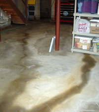 Flooding entering a basement through a floor crack in Candler