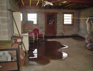 a flooded basement floor in a Newberry home