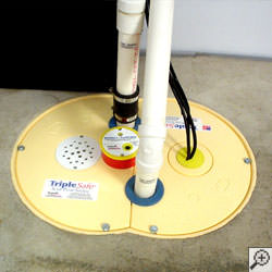 A sump pump system installed along a basement floor in Asheville.