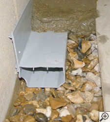 A no-clog basement french drain system installed in Hendersonville