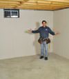 Greer basement insulation covered by EverLast™ wall paneling, with SilverGlo™ insulation underneath
